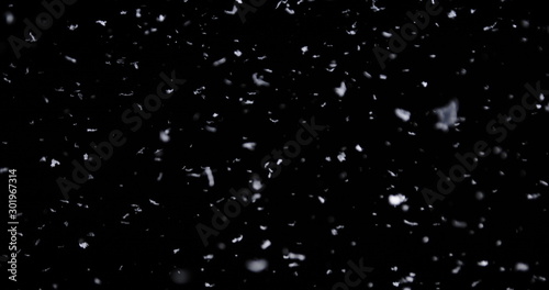 Falling real snowflakes, heavy snow, shot on a black background, frosted, wide-angle, insulated, ideal for digital composition, post-production photo