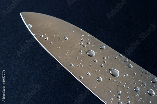 drops of water on a knife steel surface © eliosdnepr