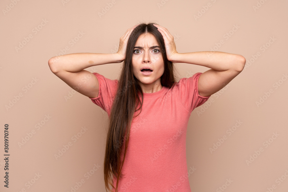 Young woman over isolated background with surprise facial expression Young woman over isolated background with surprise facial expression
