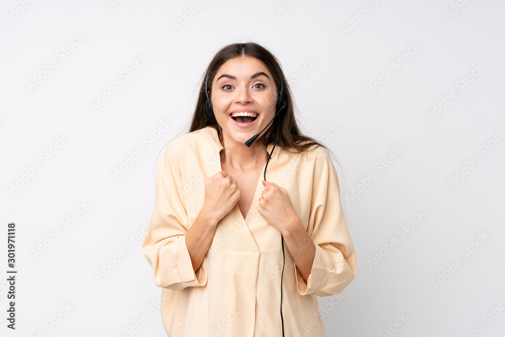 Young telemarketer woman over isolated white background celebrating a victory Young telemarketer woman over isolated white background celebrating a victory