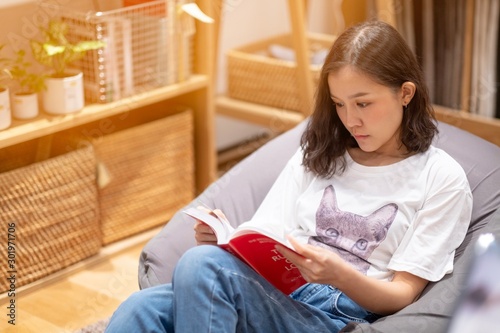 A girl reading a book in leaving room