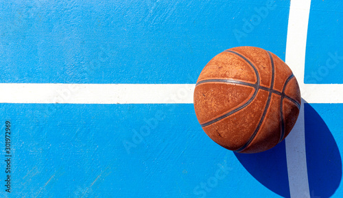 sport concept. old basketball on court. over light © memorystockphoto