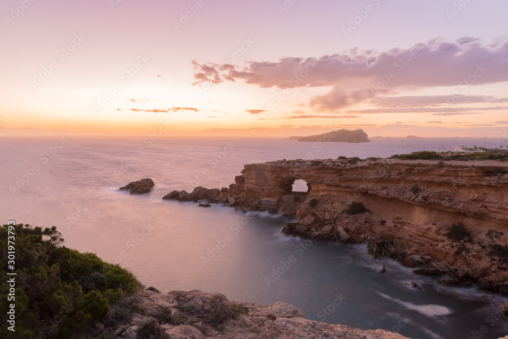 Ibiza sunset from Cala Conta Comte in San Jose at Balearic Islands Spain.