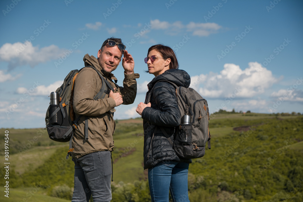 Happy hikers on a mountain trail