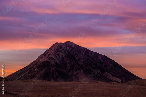 Mountain in Nevada desert at late sunset