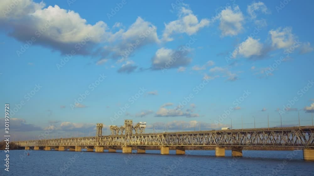 Amur (Old) railway bridge across the Dnieper River in Dnepropetrovsk on the sunset , Ukraine Amur (Old) railway bridge across the Dnieper River in Dnepropetrovsk on the sunset , Ukraine