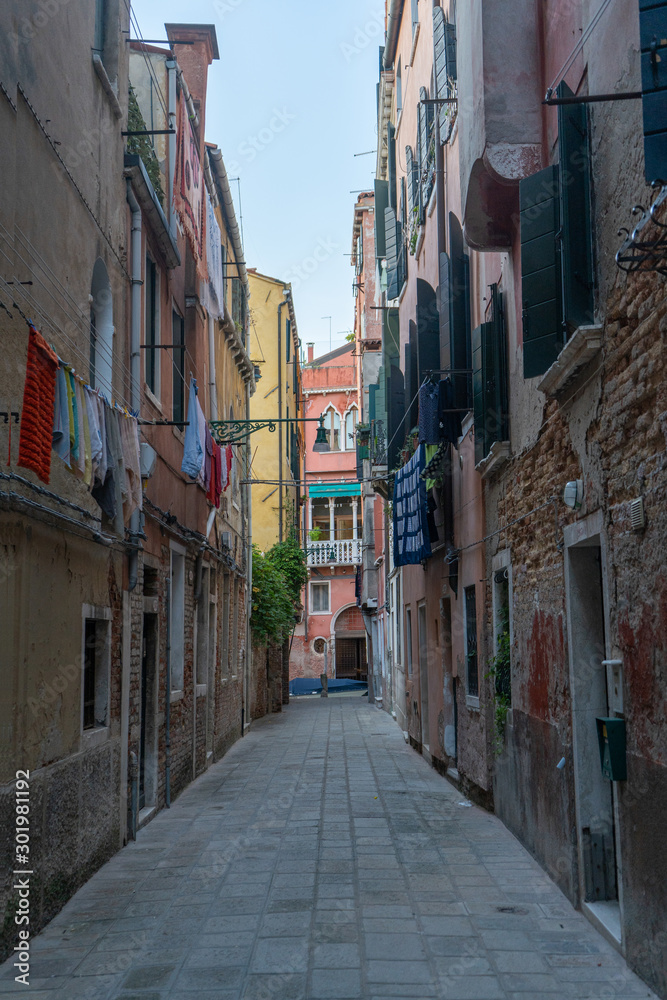 Old street in Venice with outdoor laundry. Travel photo. Italy. Europe