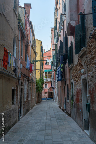 Old street in Venice with outdoor laundry. Travel photo. Italy. Europe © Viktoras