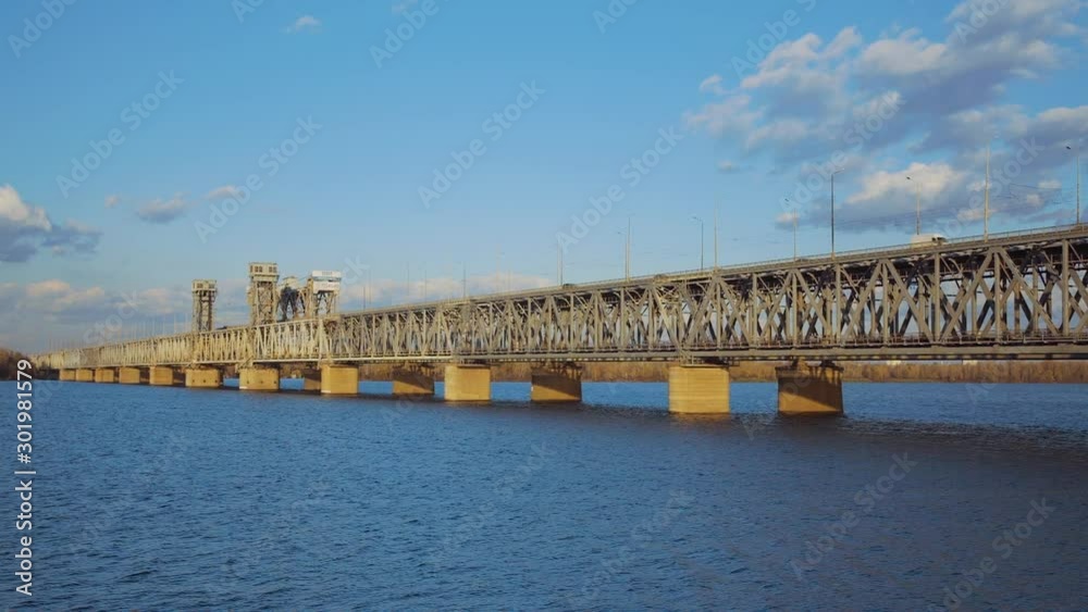 Amur (Old) railway bridge across the Dnieper River in Dnepropetrovsk on the sunset , Ukraine Amur (Old) railway bridge across the Dnieper River in Dnepropetrovsk on the sunset , Ukraine