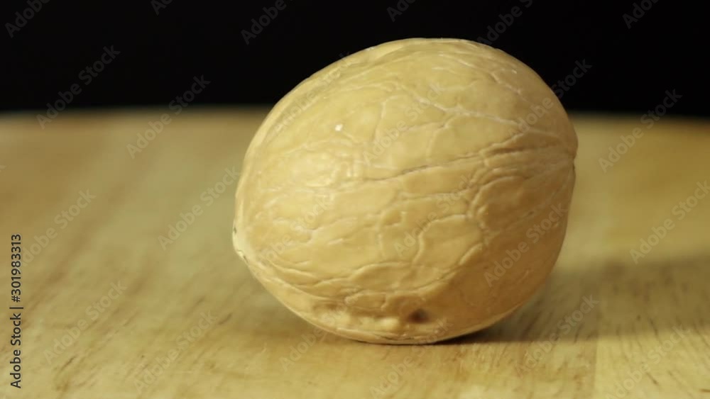 walnut rotates 360 degrees on a wooden platform walnut rotates 360 degrees on a wooden platform