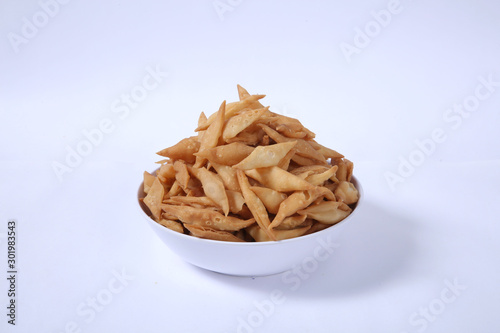 Shakkar pare Also Know as Shakkarpare, Shakarpare, Shakarpali, Shakkar Para, Sakarpara or Shankarpalli or shankar pale is a Snack Typically Made in India During Diwali - Image photo