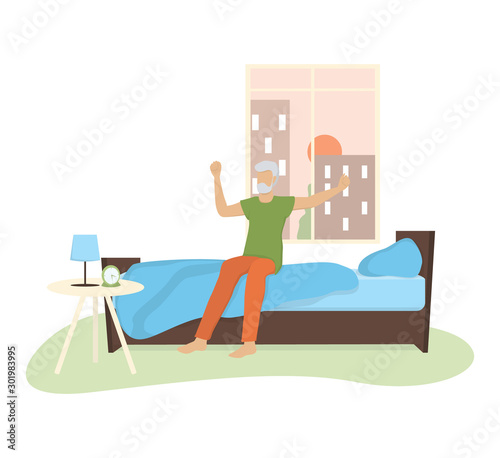 Old man wearing a pajama in the bed after a sleep. Old man