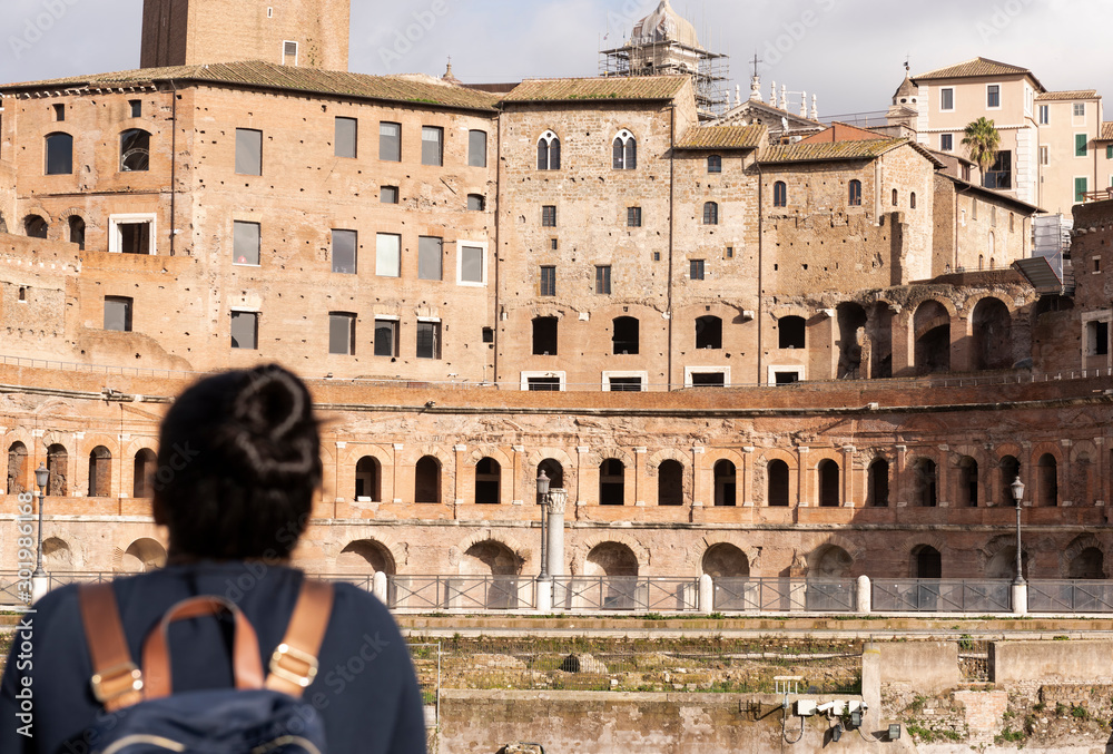tourist who admires the Roman ruins in Rome