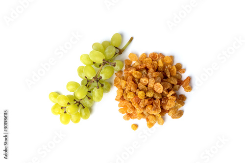 Raisin and green grape isolated on white background.