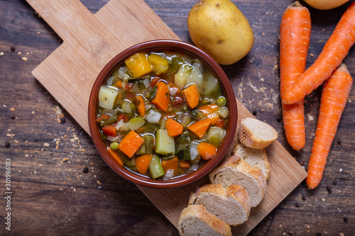Cuadro en lienzo Mixed vegetable soup with bread view from the top
