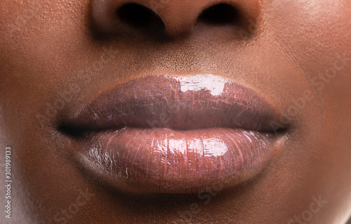 Perfect plump lips of black woman after filler injections photo