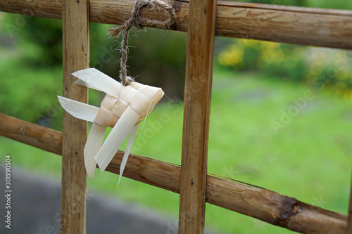 Thai-style fish mobiles: Pla ta pian is hanging at bamboo fence it is the symbol of prosperity photo