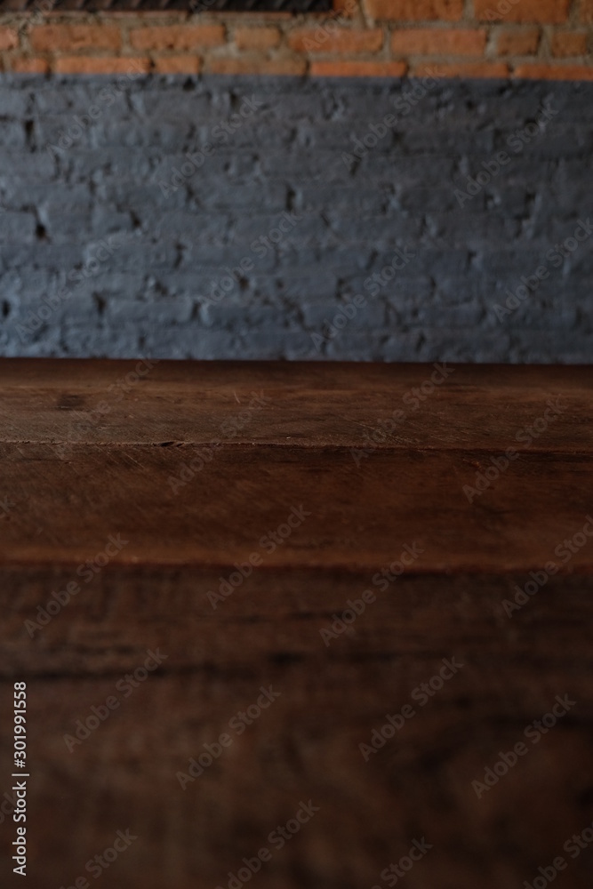 Empty top of wooden table or counter isolated on rustic brick Texture background. For product display Empty top of wooden table or counter isolated on rustic brick Texture background. For product display