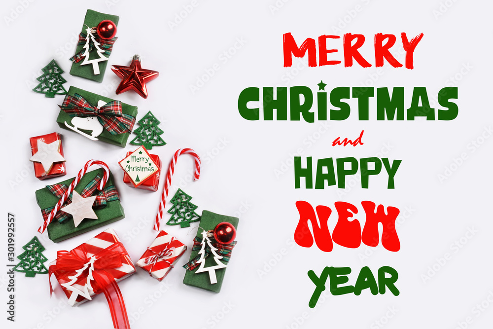 white background with small Christmas gift boxes decors and greetings white background with small Christmas gift boxes decors and greetings