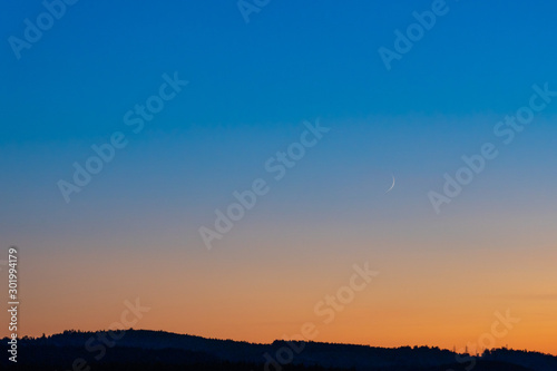 Photography Colorful clear sky with no clouds at dusk after sunset.