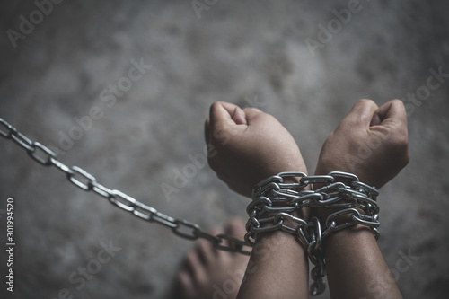 Fotografie, Obraz Children with chain tied, imprison, retarded, Child Abuse,  victims of human tra