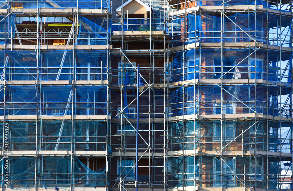 Construction site building with scaffolding Construction site building with scaffolding