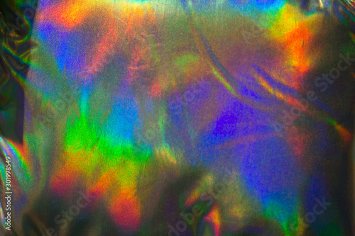 close up holographic jacket , trendy abstract bright background