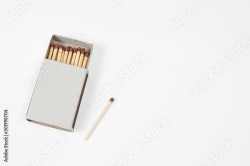 a half open box of matches and one match outside the box on a white background is a kind of super