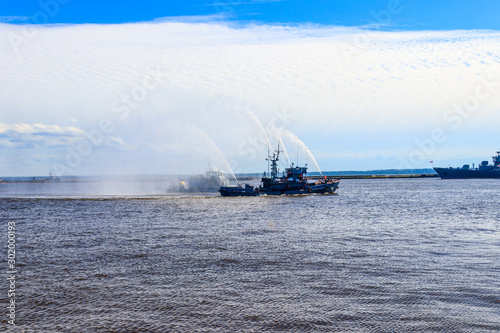 Extinguishing a burning ship during naval exercises