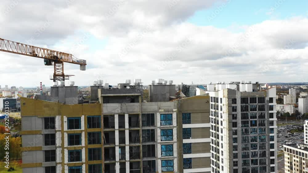 Aerial shot of city tower apartment block buildings under construction near National Library landmark in Belarus, Minsk. Aerial shot of city tower apartment block buildings under construction near National Library landmark in Belarus, Minsk.