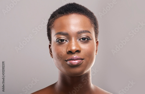 Portrait of black girl with perfect skin and natural makeup