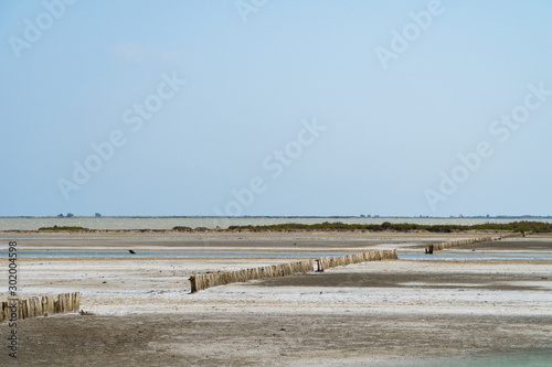 The dry soil of an old salt sea under the blue sky