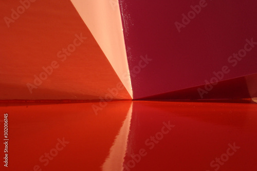 Red abstract diagonals background in painted metal