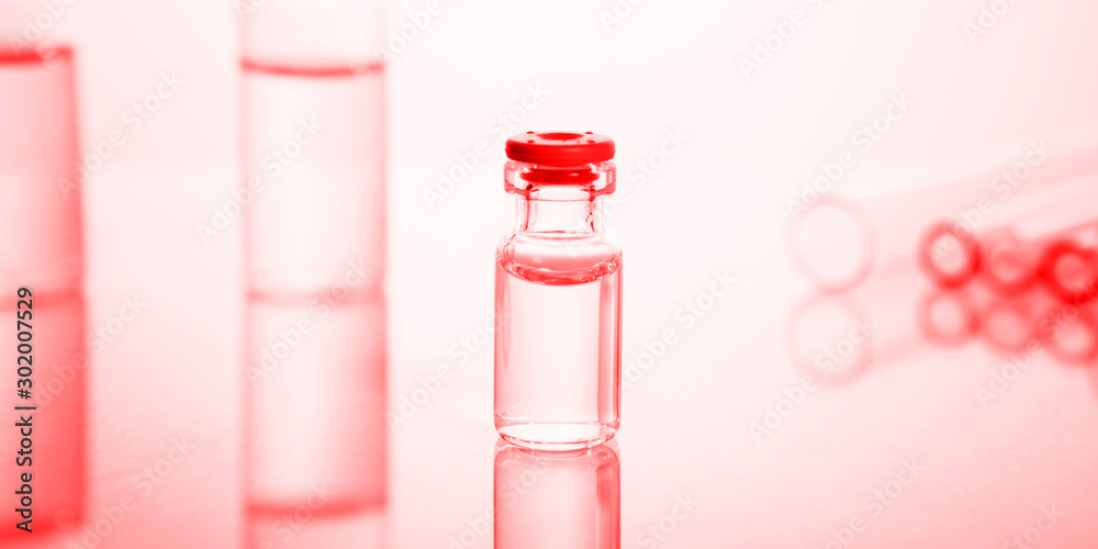 Group of vials with medication on blue methacrylate table. Group of vials with medication on blue methacrylate table.