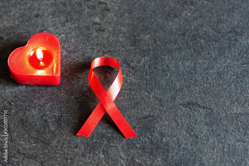 World aids day December 1 with red ribbon, campaign help people with living with HIV. photo