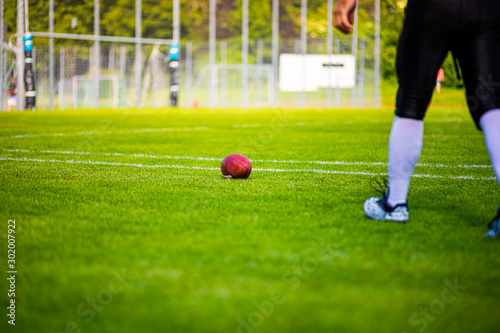 Football and Football Player on Playfield