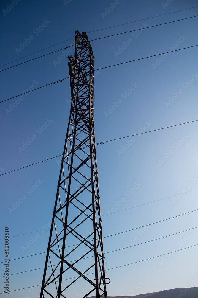 electricity pylon against blue sky electricity pylon against blue sky