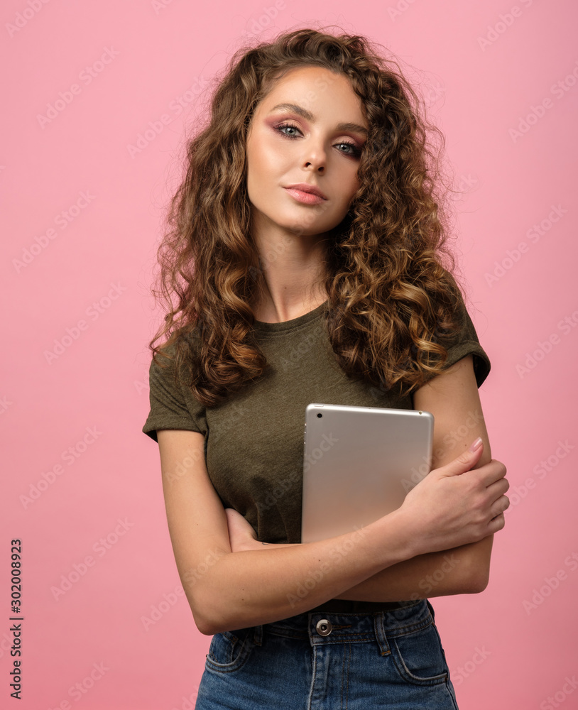 Pretty girl with electronic tablet isolated on pink Pretty girl with electronic tablet isolated on pink