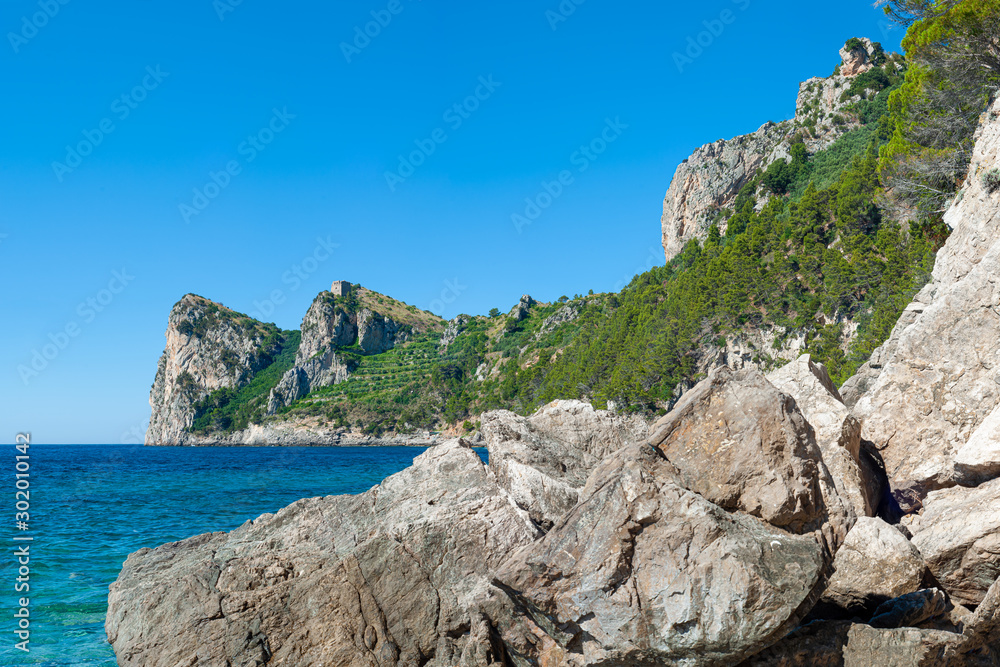 Three mountain laces, which stands on the bay of Nerano of Massa Lubrense, with the Montalto Tower on the summit, half hidden by the sea cliff