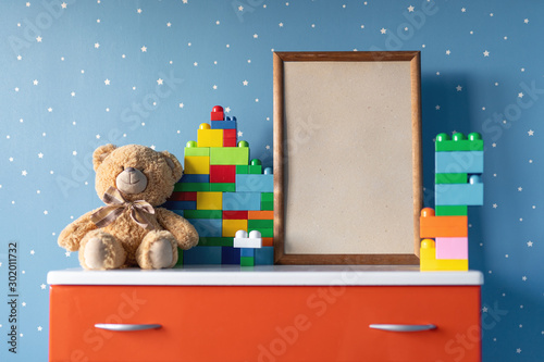 teddy bear and frame in living room photo