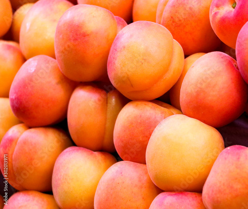 Fresh juicy peaches at a market stand in Europe