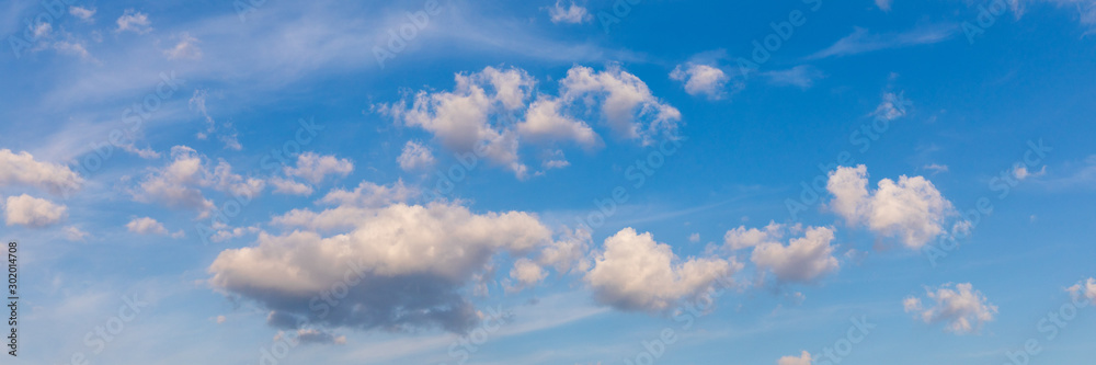 Fototapeta premium Clouds and blue sky background. Blue sky background with clouds. Beautiful clouds with blue sky background. Nature weather, cloud blue sky and sun.