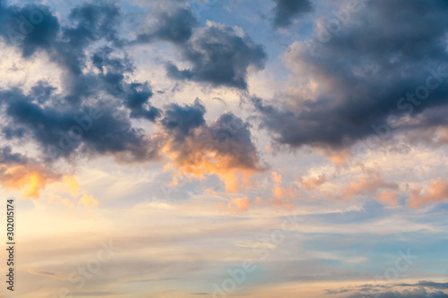 Fototapeta Naklejka Na Ścianę i Meble -  Beautiful sunset sky above clouds with dramatic light. Sunset sky for background, sunrise sky and clouds. Bright orange and blue sky and light of the sun. Beautiful sky with cloud before sunset.