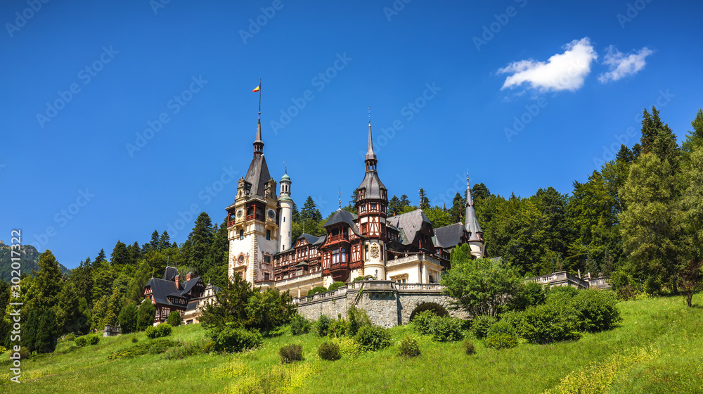 Peles Castle, Romania. Beautiful famous royal castle and ornamental garden in Sinaia landmark of Carpathian Mountains in Europe Peles Castle, Romania. Beautiful famous royal castle and ornamental garden in Sinaia landmark of Carpathian Mountains in Europe