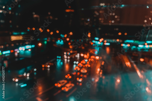 Defocused urban abstract city lights at night, colorful bokeh. Abstract auto, city street, traffic, transportation concept