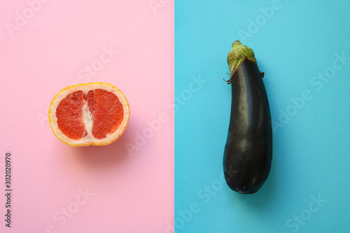 Abstract symbols for male and female gender (sex) shown as half a grapefruit and an eggplant photo