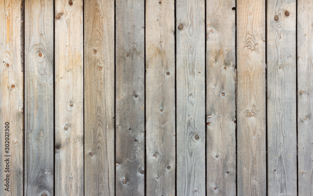 Wooden background, rustic fence, texture of natural wood darkened by time. Wooden background, rustic fence, texture of natural wood darkened by time.