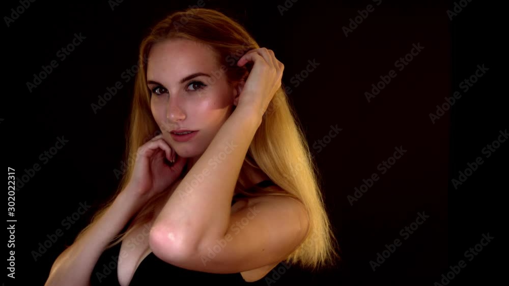 Voluptuous and sensuous woman portrait on black background Voluptuous and sensuous woman portrait on black background