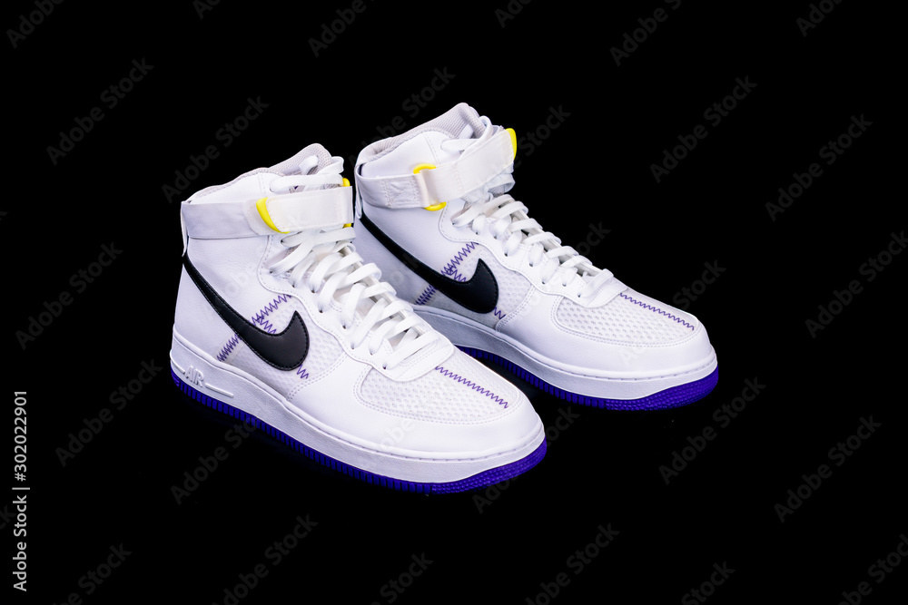 A modern take on the classic Nike Air Force 1 High Top Basketball shoes sneakers with purple and yellow touches with leather and mesh combination Stock Photo Adobe Stock
