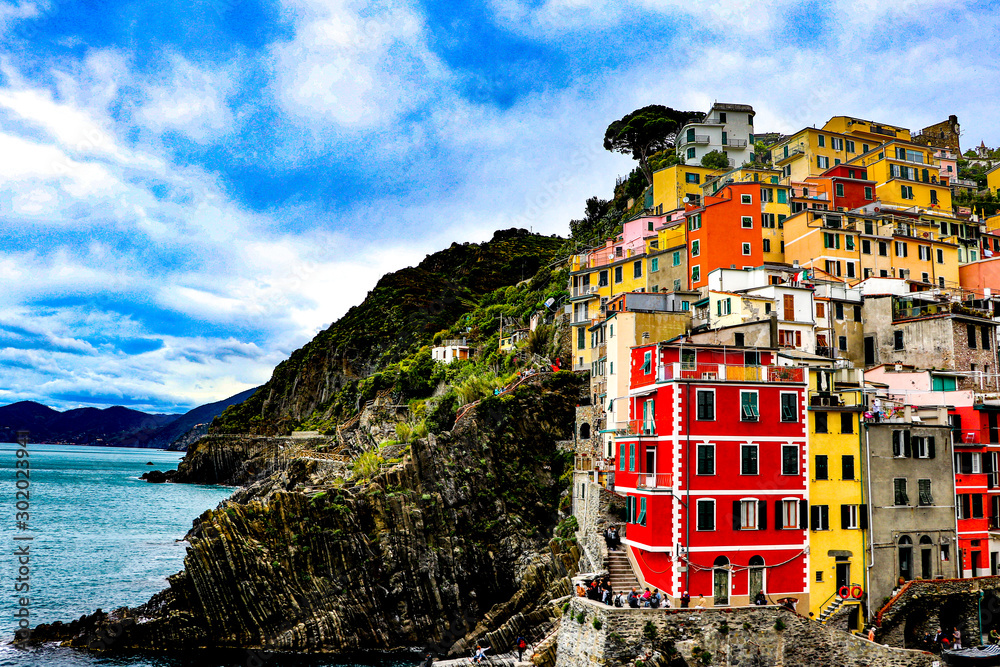  exploring the coastal village of Manarola, which is a small village in the Liguria region of Italy known as Cinque Terra